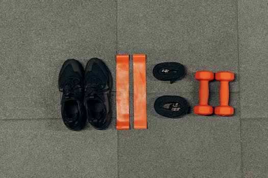 Black Sneakers And Gym Tools on Gray Floor