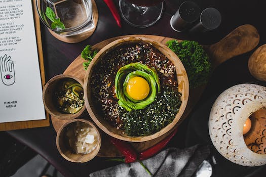 Healthy east dish served on wooden cutting board in cafe