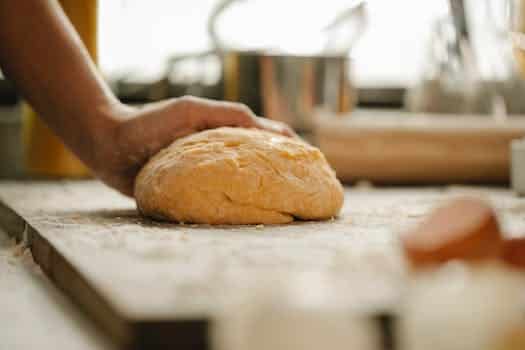 Chef making fresh dough in bakery