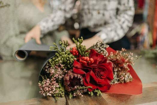 Red Rose Bouquet on Brown Wooden Table